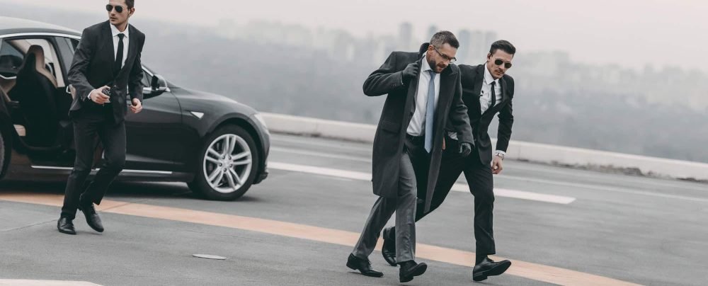 bodyguards protecting businessman on his way from car